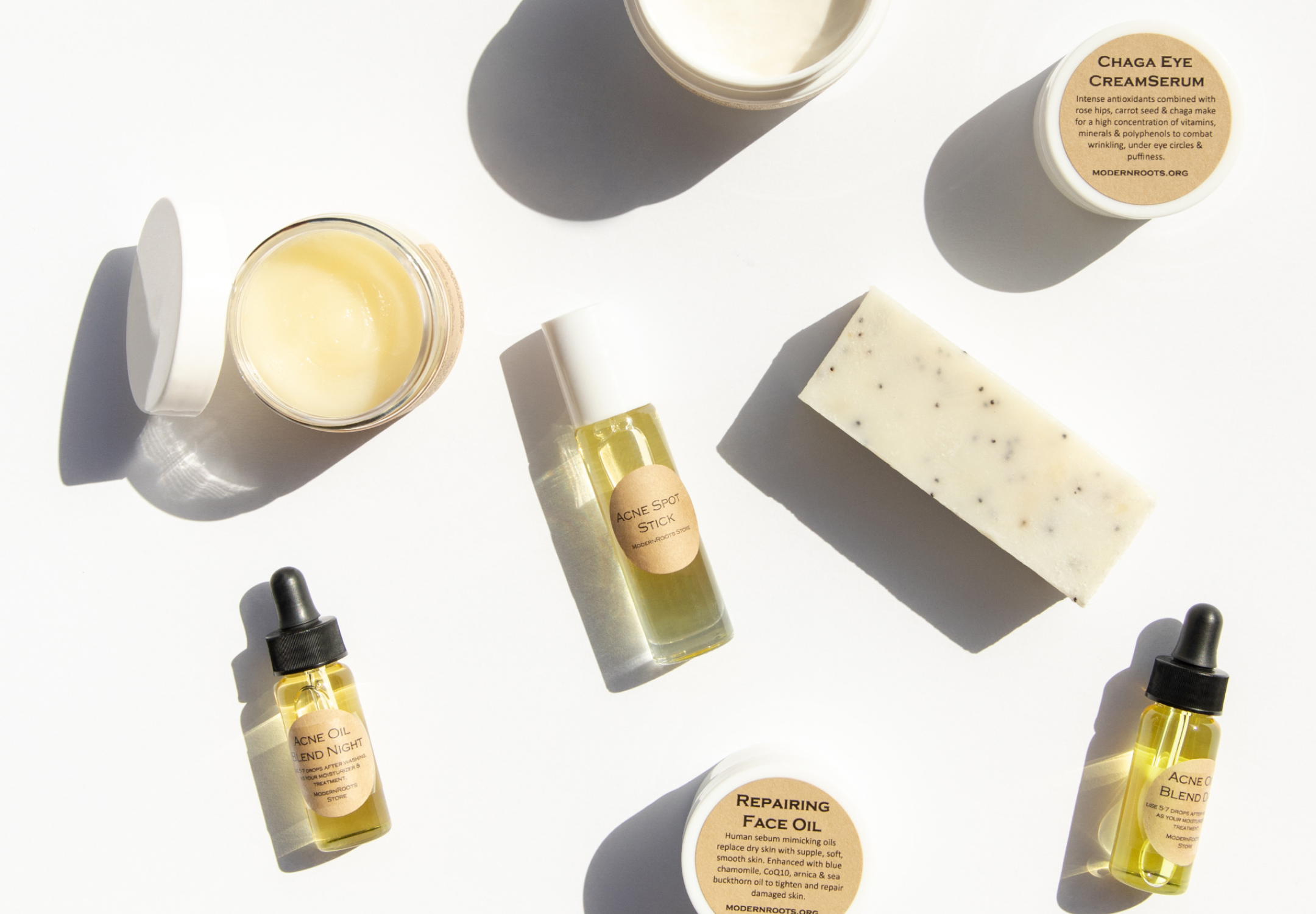 Clean & Non-Toxic skincare feature image. Featuring Chaga eye cream, acne oil, acne spot stick, hydrating body butters, lotions, and a hand made soap bar