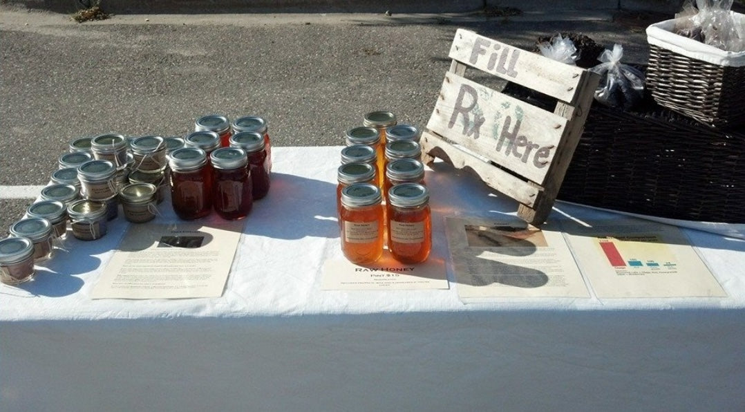 Modern Roots holistic & non-toxic skincare products on a table at a Farmer's Market for the very first time. 